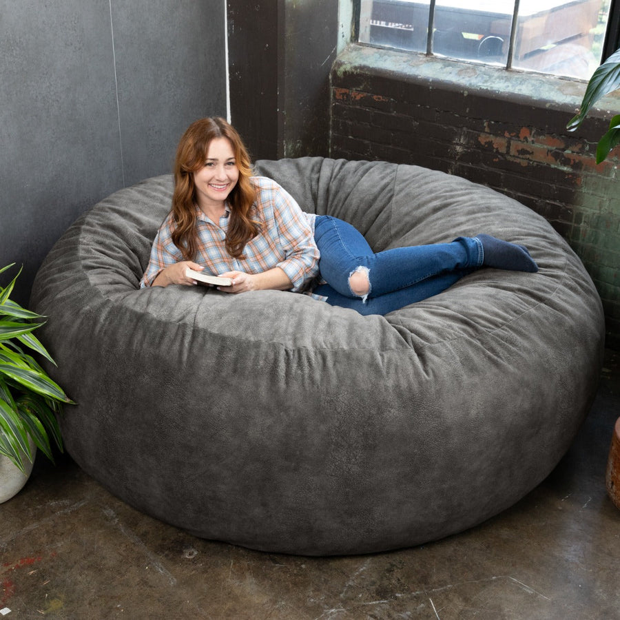 Model lounging on the Jaxx Saxx 6 in Faux Hide Fabric