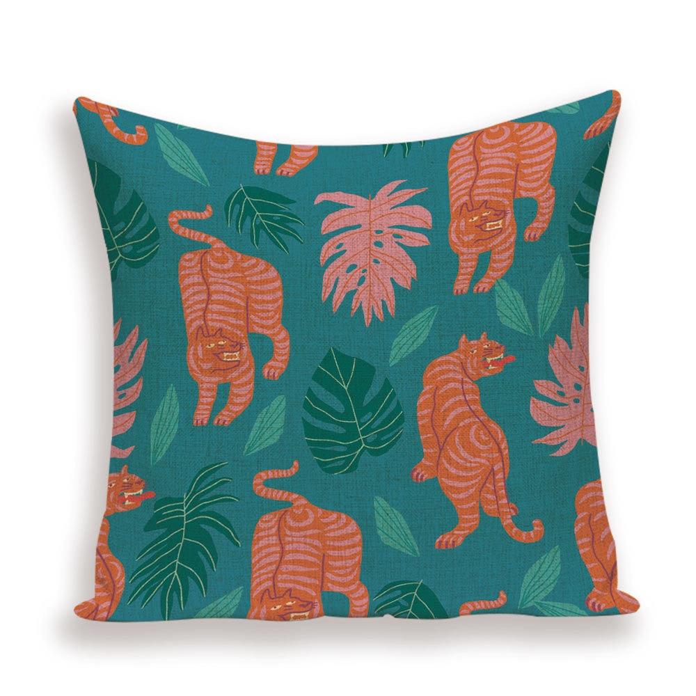 Pillow cover with orange tigers and leaves on teal